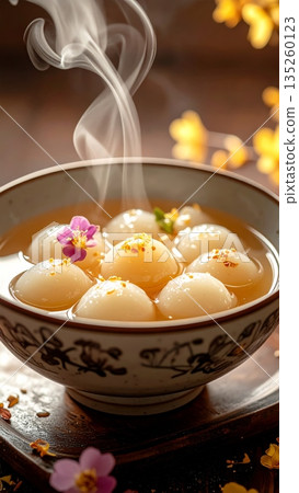 Chinese White Tangyuan Dessert Filled with Honey and Sweet Syrup 135260123