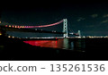 Akashi Kaikyo Bridge lit up in red 135261536