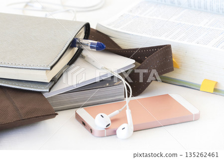 notebook, mobile phone and dictionary book for study in bag 135262461