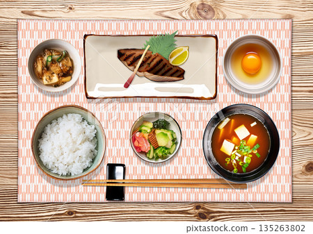 A traditional Japanese breakfast and a placemat with the traditional "Yagasuri" pattern 135263802