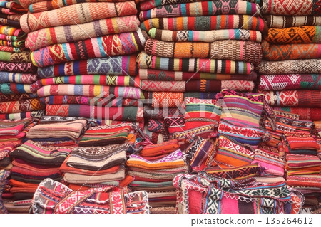 Textiles for sale in a Peruvian market 135264612
