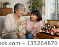 Grandmother and grandchildren enjoying Hinamatsuri 135264870