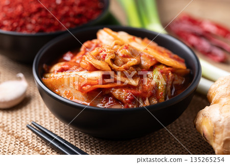 Kimchi cabbage in a bowl with ingredients, Korean food Kimchi cabbage in a bowl with ingredients, Korean food 135265254