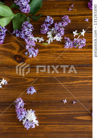 Purple lilac on top on wooden surface with blank space Purple lilac on top on wooden surface with blank space 135265890