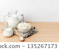 Fresh cottage cheese, milk, and yogurt creating a healthy breakfast 135267173