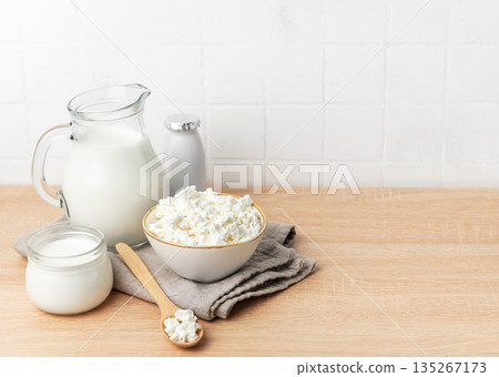 Fresh cottage cheese, milk, and yogurt creating a healthy breakfast 135267173
