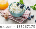 Cottage cheese bowl with fresh blueberries and honey 135267175