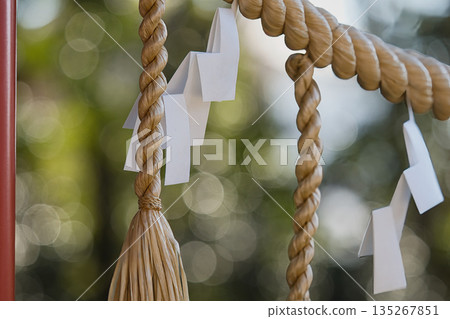 Shimenawa on the torii gate of a shrine Shimenawa on the torii gate of a shrine 135267851