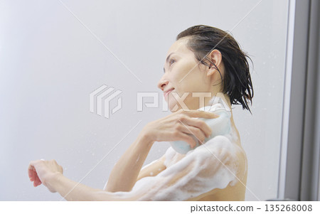 Woman washing body in the bathroom 135268008
