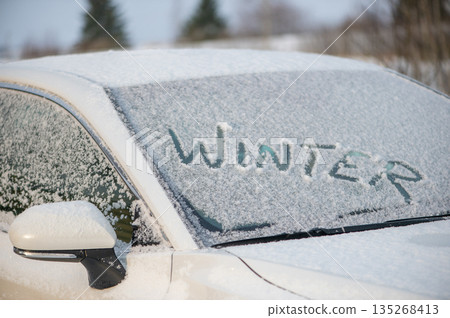 Winter Message Written On Snowy Car Window Winter Message Written On Snowy Car Window 135268413