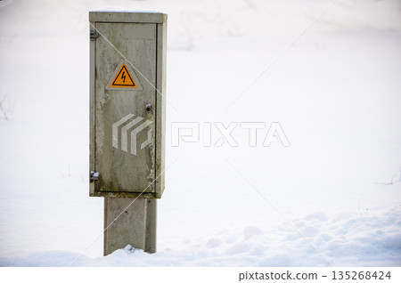 Electrical Utility Box Standing in Snow Landscape 135268424