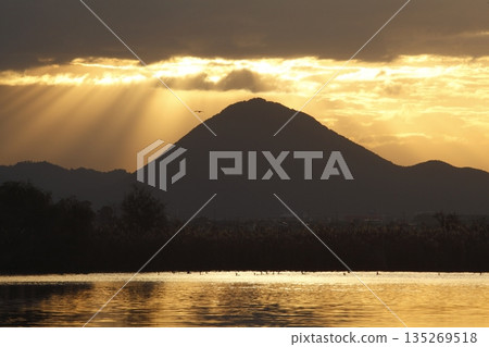 Mount Mikami at sunrise as seen from Lake Kihamauchi Mount Mikami at sunrise as seen from Lake Kihamauchi 135269518