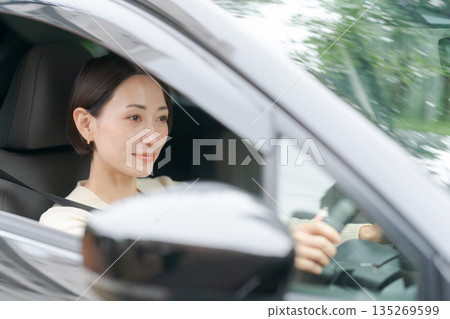 A woman driving a car A woman driving a car 135269599