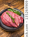 Raw Duck breast fillet slices for stir-fry cooking. wooden background. top view 135269909