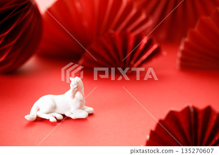 A festive Chinese New Year background with red paper fans. A festive Chinese New Year background with red paper fans. 135270607
