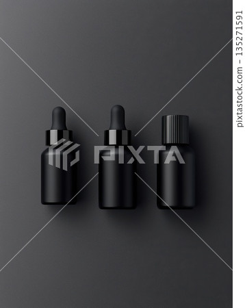 Sleek black cosmetic bottles with dropper and screw caps positioned on dark gray background, embodying minimalist skincare packaging design 135271591