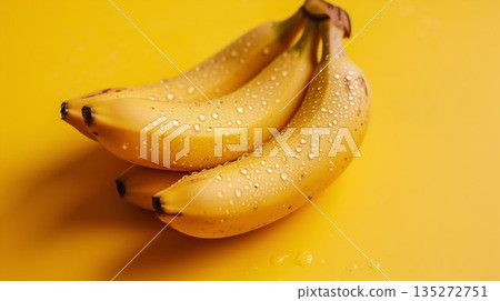 Fresh Bananas with Water Drops on Yellow Background. Generative ai 135272751