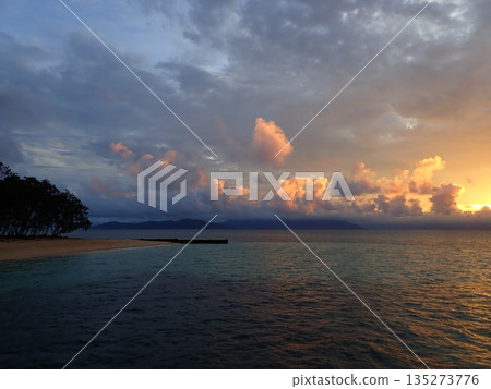 The sun setting over Cairns 135273776