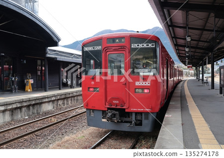 A Kyudai Main Line train stopping at JR Yufuin Station A Kyudai Main Line train stopping at JR Yufuin Station 135274178