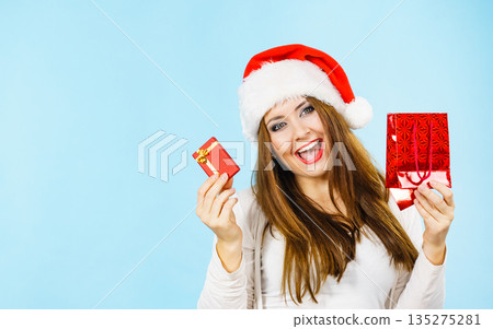 Happy Christmas woman holds red gift box 135275281