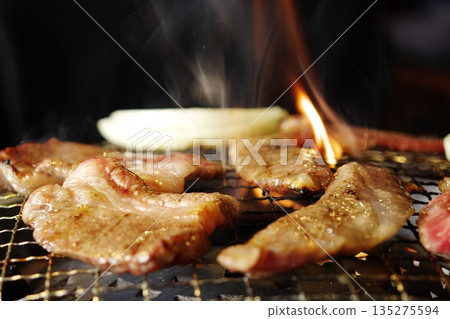 Juicy grilled meat with the realistic flames and smoke Juicy grilled meat with the realistic flames and smoke 135275594