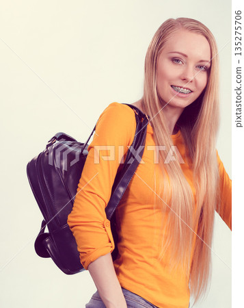Young woman going to school Young woman going to school 135275706
