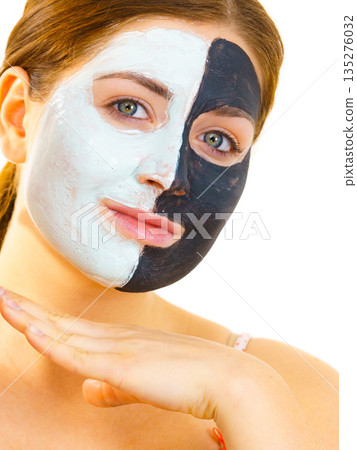 Girl with black white mud mask on face 135276032