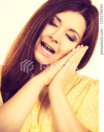 Sleepy calm woman gesturing Sleepy calm woman gesturing 135276050