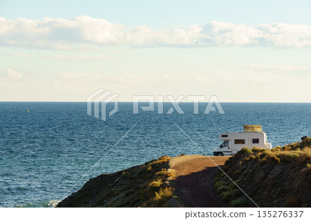 Caravan with tilt solar panels on roof. 135276337