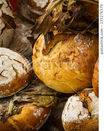 Many rustic fresh bread loaves Many rustic fresh bread loaves 135276370