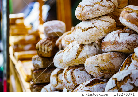 Many rustic fresh bread loaves Many rustic fresh bread loaves 135276371
