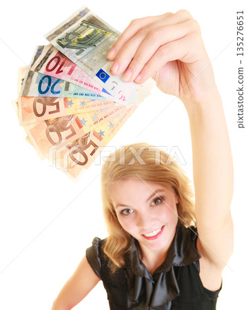 Rich woman showing euro currency money banknotes. Rich woman showing euro currency money banknotes. 135276651