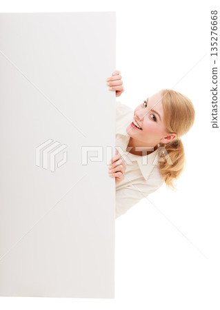 Businesswoman hiding behind blank copy space banner Businesswoman hiding behind blank copy space banner 135276668