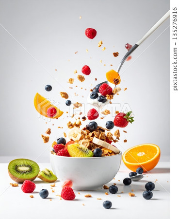 A healthy breakfast bowl of fresh muesli with berries and milk features a nutritious meal of oats, granola, and strawberries for a sweet morning diet A healthy breakfast bowl of fresh muesli with berries and milk features a nutritious meal of oats, granola, and strawberries for a sweet morning diet 135276916