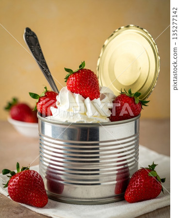 Fresh organic strawberries in a glass jar create a delicious healthy summer snack of ripe red berries full of natural sweetness and juicy freshness Fresh organic strawberries in a glass jar create a delicious healthy summer snack of ripe red berries full of natural sweetness and juicy freshness 135277142