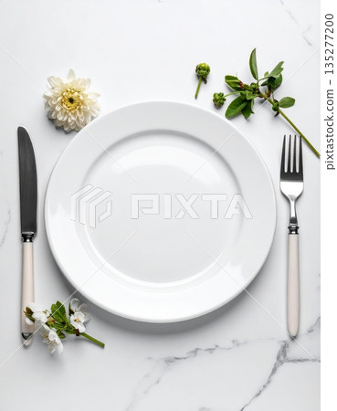Clean white plate with silverware cutlery including a fork and knife on an empty restaurant table setting for a dinner meal dishware isolated kitchen utensil background Clean white plate with silverware cutlery including a fork and knife on an empty restaurant table setting for a dinner meal dishware isolated kitchen utensil background 135277200