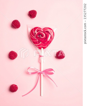 A red heart on a white or wooden background serves as a romantic symbol for a Valentine's Day gift card, featuring a blank paper letter and vector illustration design for a wedding celebration 135277202