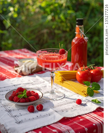 A delicious fresh tomato and basil salad served on a white plate makes a healthy red vegetarian appetizer or lunch dish A delicious fresh tomato and basil salad served on a white plate makes a healthy red vegetarian appetizer or lunch dish 135277216