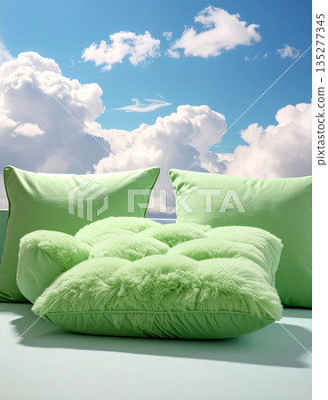 A soft pink silk cushion with a vintage cotton textile pattern rests comfortably on the beach, grass, and sky as a colorful fabric decoration 135277345