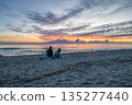 sunrise romantic couple on Corsican coast near Bastia Etang de Biguglia Camping San Daminao Beachside Corse 135277440