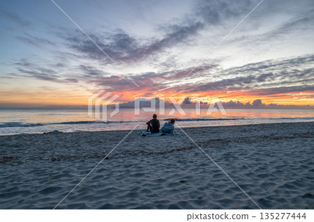 sunrise romantic couple on Corsican coast near Bastia Etang de Biguglia Camping San Daminao Beachside Corse sunrise romantic couple on Corsican coast near Bastia Etang de Biguglia Camping San Daminao Beachside Corse 135277444