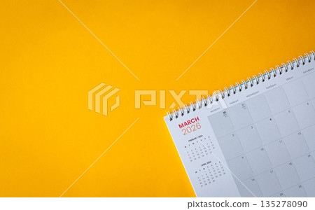 March 2026 calendar on top of yellow surface. 135278090