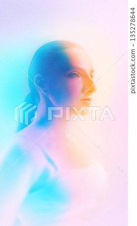 Dreamy female portrait in soft focus with color gradient lighting. 135278644
