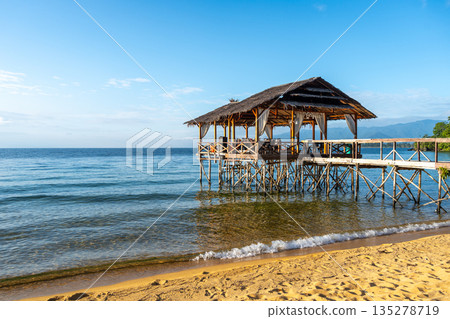 Wooden pier on the beach of Lake Poso, Tentena, Sulawesi Wooden pier on the beach of Lake Poso, Tentena, Sulawesi 135278719