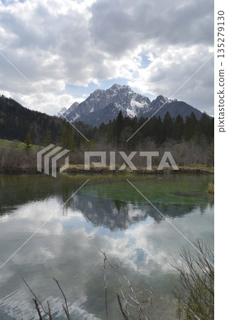 Alpine lake reflection of Ponce mountainsAlpine lake reflection of Ponce mountains 135279130