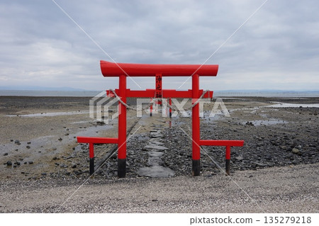 Ariake Sea Underwater torii gate at low tide Ariake Sea Underwater torii gate at low tide 135279218