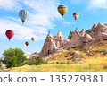 Balloon flight, famous tourist attraction of Cappadocia. Air balloons and Fairy Chimney in Pasabag Valley, Anatolia, Turkey. Topic of vacation, travel, trip abroad on vacation, cruises and tours 135279381