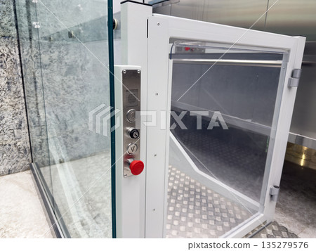 Control panel with buttons on wheelchair accessible elevator. Modern elevator near obstacle to lift person with disabilities to desired floor. Safe elevator for people with mobility issues Control panel with buttons on wheelchair accessible elevator. Modern elevator near obstacle to lift person with disabilities to desired floor. Safe elevator for people with mobility issues 135279576