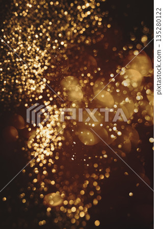 Golden abstract bokeh on black background. Golden abstract bokeh on black background. 135280122