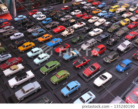Flea antique market in Europe, Italy. Old vintage items. Toys, car, transport on tables in town. Retro objects for background design. Flea antique market in Europe, Italy. Old vintage items. Toys, car, transport on tables in town. Retro objects for background design. 135280190